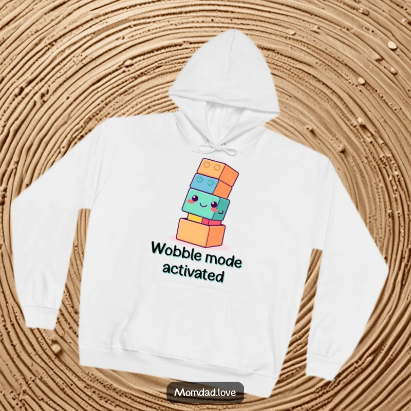 Funny hoodie with a wobbly building block tower that has a gentle smile, radiating a vibe of cozy humor and endearing instability.