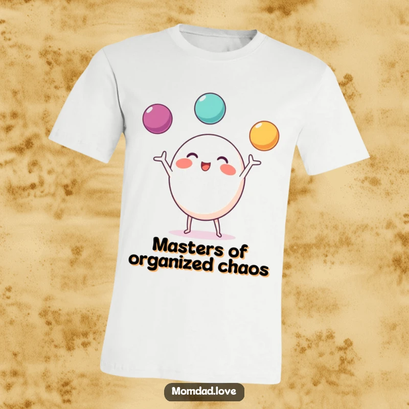 Funny T-Shirt of a round character with small limbs, enthusiastically juggling three bright balls.